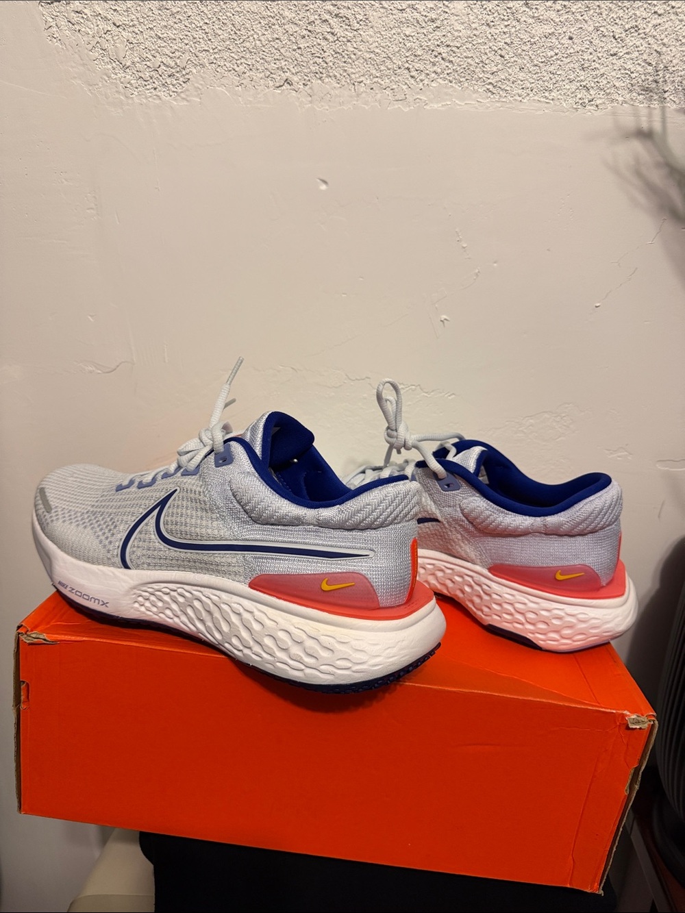 Nike White and Blue Running Sneakers with Coral and Yellow Accents